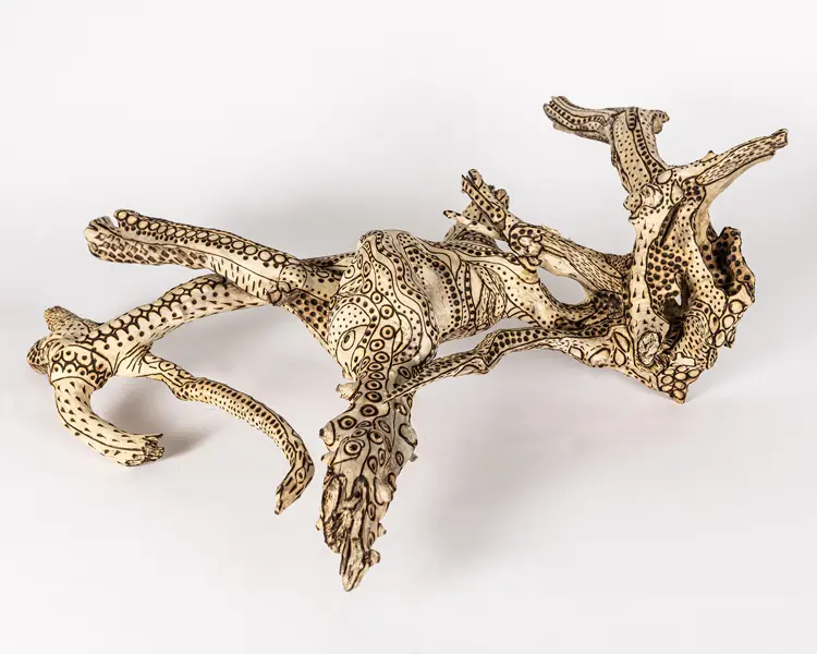 tattooed wood art piece