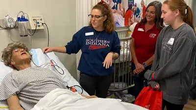 Student gets a tour of the Simulation Center on Health Professions Day