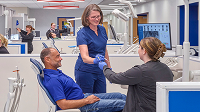Dental clinic staff treat a patient in the USI Dental Clinic