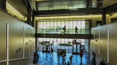 Students walking in the Romain College of Business