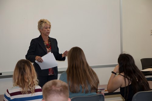 Giles talking to students