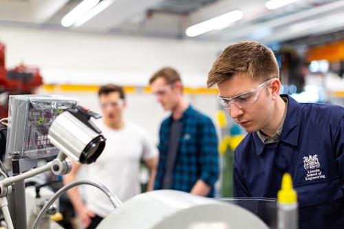 An engineering student works in a lab