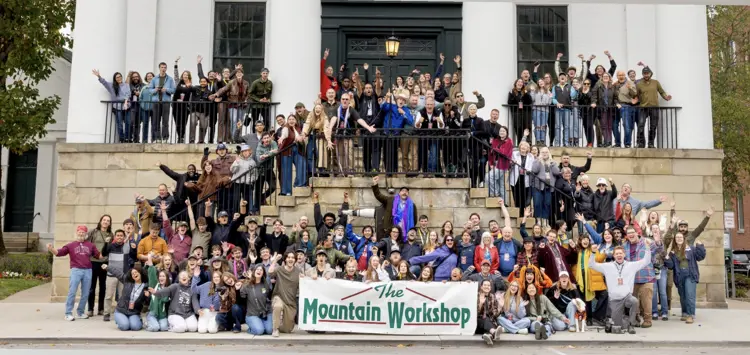 Photo of a large group posing at The Mountain Workshop, a photojournalism workshop