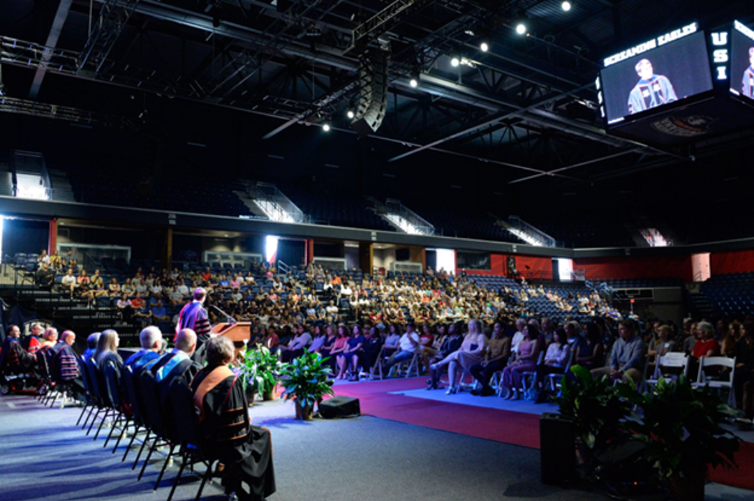 New students listen to a faculty speech at convocation event