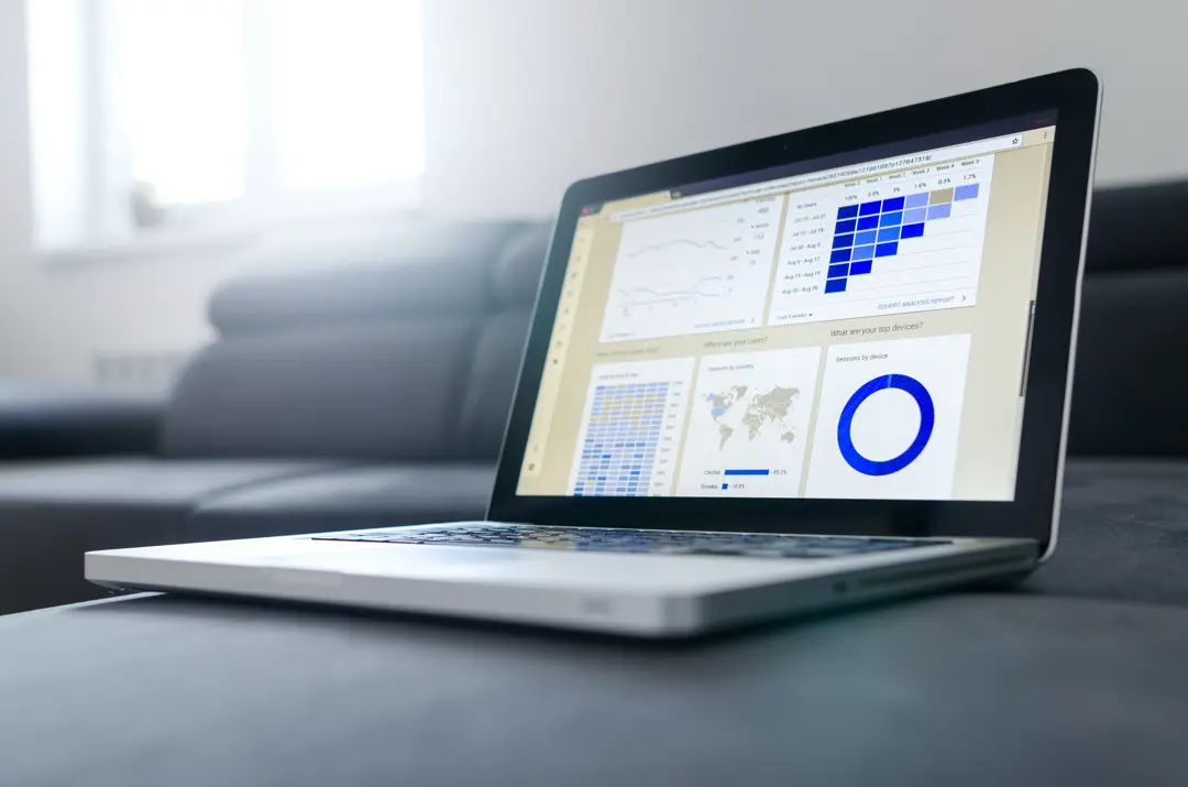 Laptop screen with a data charts and graphs on it