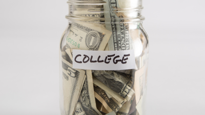 U.S. bills in a ball jar labeled "college"