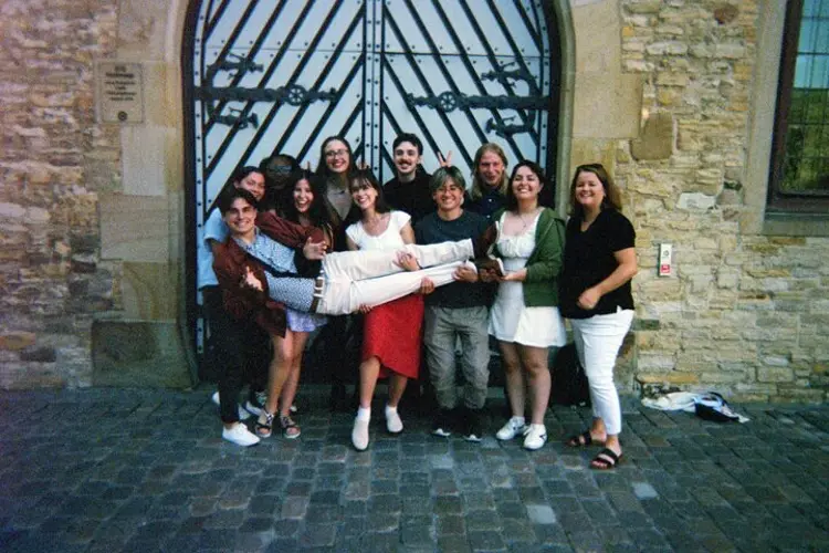 Advanced intensive German program students pose in front of Osnabrück's Historic City Hall