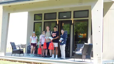 Students standing outside of the Minka House