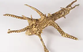 tattooed wood art piece