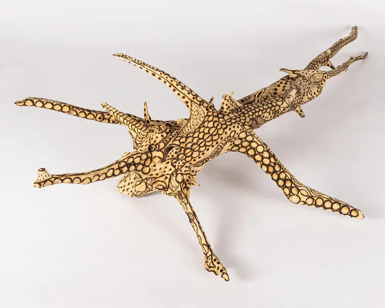 tattooed wood art piece