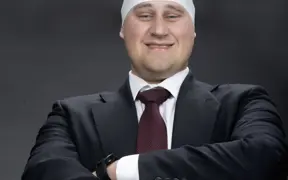 A member of the homecoming court wears one of the swim hats left in the studio for one of his homecoming photos.