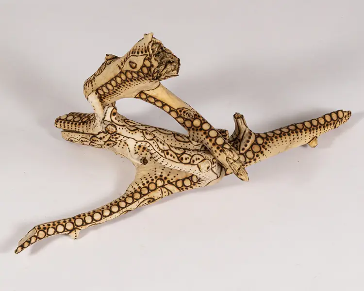 tattooed wood art piece