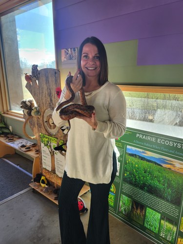 woman holding snake