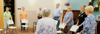A group of elderly people socialize