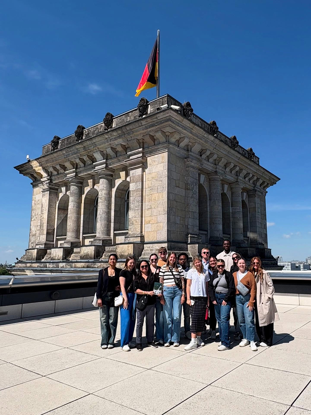 Students pose for photo on the roof of the Reichstag Building after a guided tour of the German parliament.