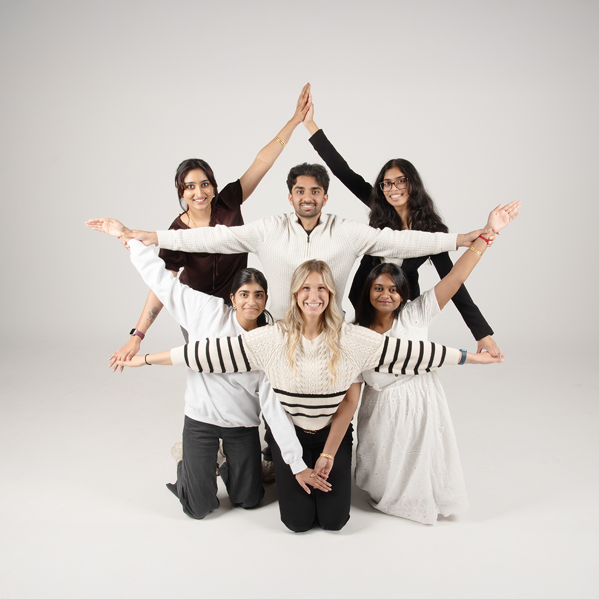 Members of the South Asian Student Union strike a fun post in the photo studio.