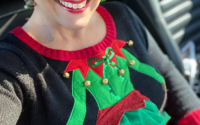 Woman wearing a ugly holiday sweater