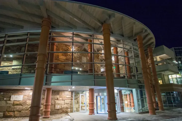 Exterior view of the Performance Center at night from University Boulevard
