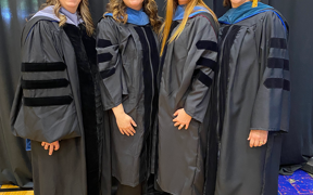Occupational therapy faculty in commencement caps and gowns