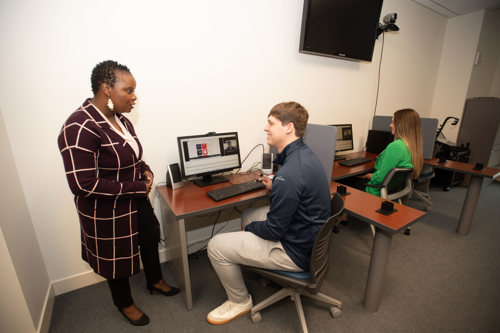A group of students work with Dr. Sabinah Wanjugu in the Biometrix Discovery Lab