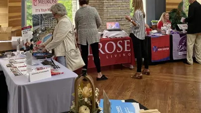 Vendors share educational materials at the Mid-America Institute on Aging