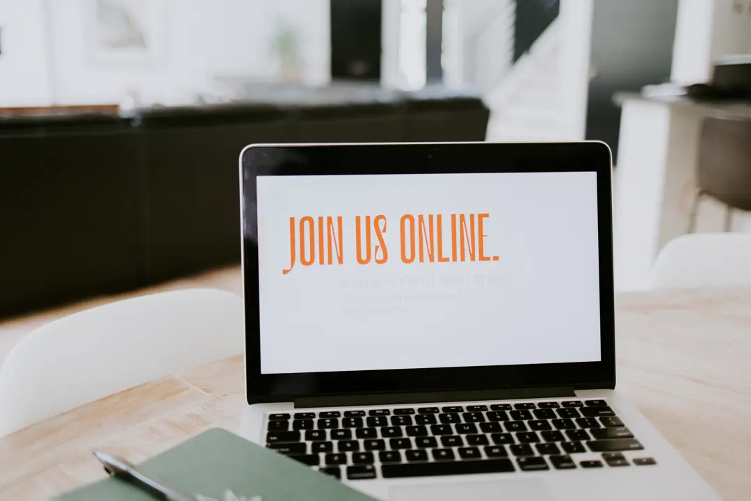 Laptop screen with a graphic that says "Join Us Online" on it