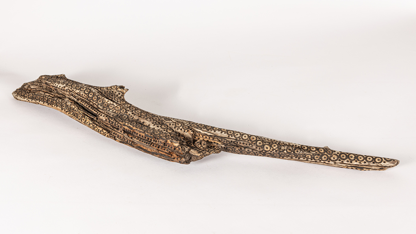 tattooed wood art piece