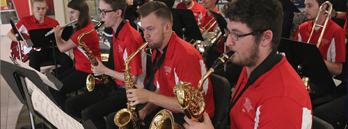 Jazz ensemble members playing instruments