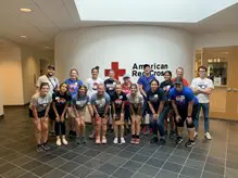 A group of student volunteers pose inside the American Red Cross