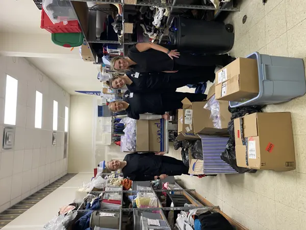 Faculty and students delivering food to the pantry