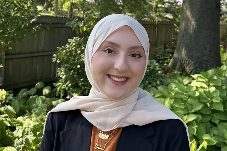 Casual portrait of USI sociology graduate Amira Alashi
