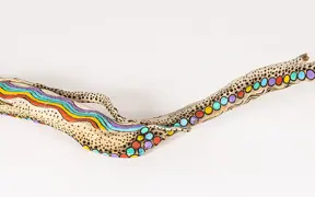 tattooed wood art piece