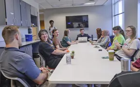 USI psychology students learn from their professor in the research lab