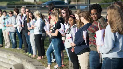A group of students standing outside together