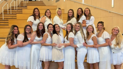 group of sorority girls posing in the Business and Engineering center Atrium