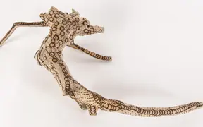tattooed wood art piece